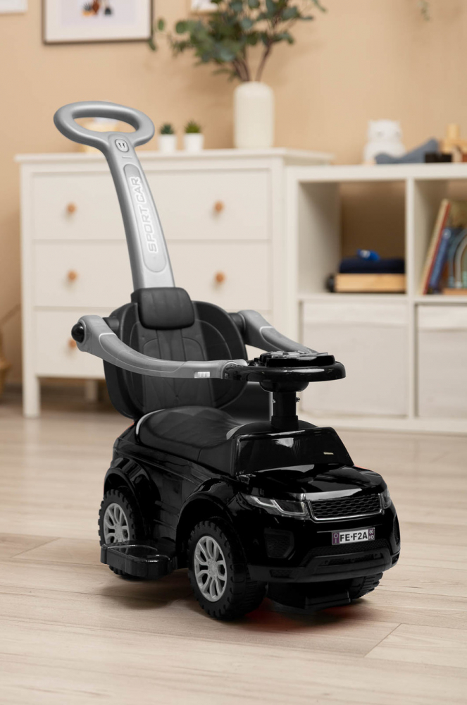 Masinuta Ride On fara pedale 3in1 Toyz Sport Car Black cu maner parental,Bara de protectie detasabila,Volan cu sunete si lumini,Spatiu de depozitare,Sistem antirasturnare,Spatar inalt,Siport picioare,Recomandata de la 12 luni - 10