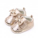 Pantofiori aurii cu imprimeu si fundita 6-9 luni marimea 19