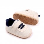 Adidasi crem cu sireturi bleumarin 6-9 luni marimea 19